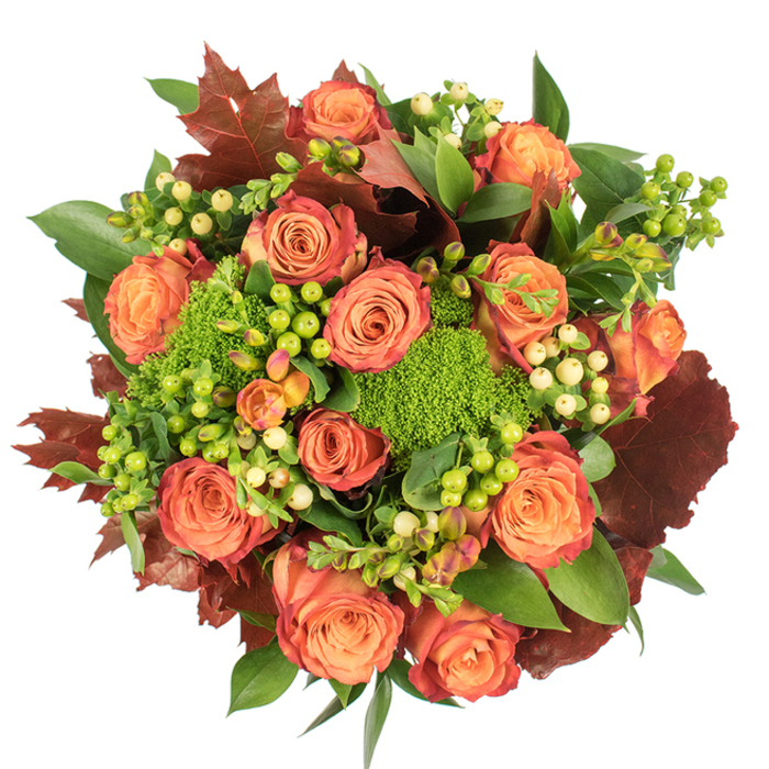Presented in a circular, densely packed top-down view against clean white, this fall-inspired bouquet celebrates the season with rich colour and layered texture. A profusion of large, fully opened roses forms the main motif; their petals melt from a warm, inner peach through coral-orange to a russet, some outer edges showing a subtle reddish-rust ink that echoes autumn leaves along the North Circular and Brent Cross Shopping Centre precincts. Nestled between the roses, clusters of Hypericum berries in lime-green and pale creamy-yellow provide crisp, jewel-like contrast, their polished surfaces catching the light like tiny sunlit beads. Vibrant green 'moss' accents of Green Trick dianthus add a tactile, almost architectural element, their dense, fuzzy heads bringing both freshness and unexpected texture. Deep, lobed leaves in burgundy and burnt umber lie throughout the arrangement like small, sculpted leaves from local park trees, balancing the brighter blooms and lending a seasonal, grounding mood. Full green foliage underpins the whole composition, creating a lush canvas that makes the oranges and greens sing. There is a subtle, earthy aroma suggested by the mix of roses and mossy filler, perfect for a warm Thanksgiving centrepiece or a thoughtful seasonal gift for neighbours in Hendon or Golders Green. As prepared by a florist familiar with Brent Cross sensibilities, this bouquet feels like a careful harvest of colour, texture, and feeling †generous, cosy, and thoughtfully composed.